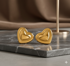 Bold Gold-Tone Stainless Steel Heart Stud Earrings - ORYX TREND EaringMake a statement with these chunky, high-polish heart stud earrings. Crafted from durable stainless steel, these earrings feature a bright gold tone and a dimensional, puffy heart shape. They are designed to be eye-catching yet comfortable for everyday wear. The stainless steel construction offers excellent resistance to tarnishing and rust.Default Title#