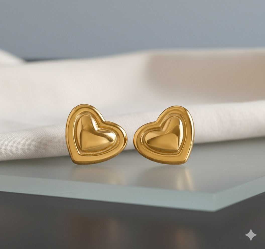 Bold Gold-Tone Stainless Steel Heart Stud Earrings - ORYX TREND EaringMake a statement with these chunky, high-polish heart stud earrings. Crafted from durable stainless steel, these earrings feature a bright gold tone and a dimensional, puffy heart shape. They are designed to be eye-catching yet comfortable for everyday wear. The stainless steel construction offers excellent resistance to tarnishing and rust.Default Title#