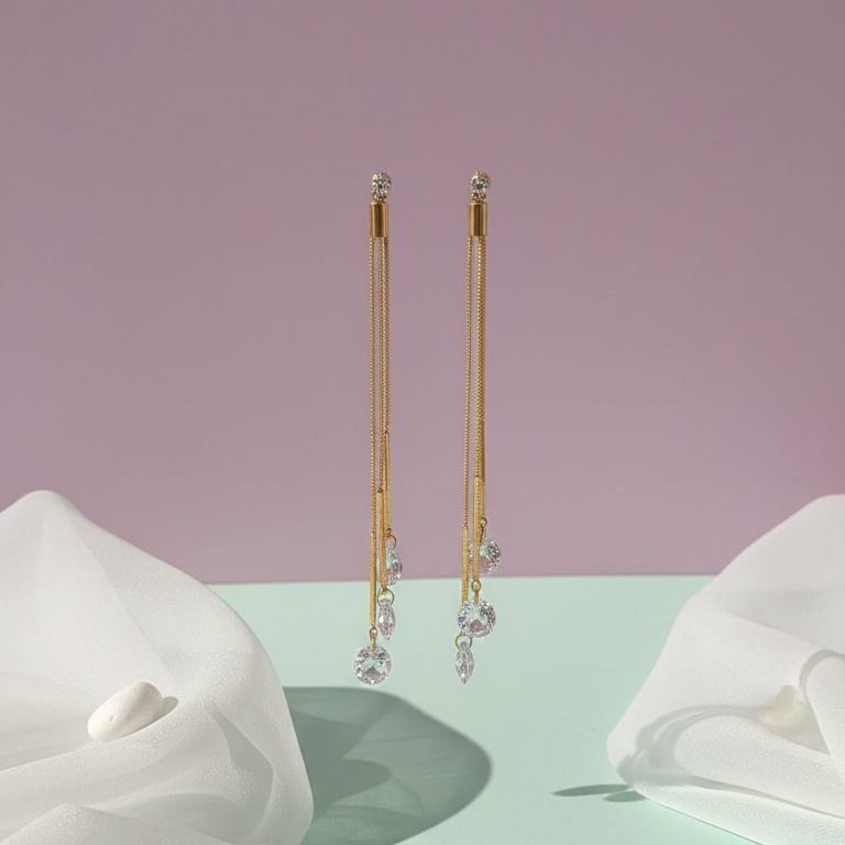 Dazzling CZ Dangle Chain Earrings - ORYX TREND EaringStep into the spotlight with these exquisite Dazzling CZ Dangle Chain Earrings. Featuring three cascading gold chains that end with brilliant, faceted Cubic Zirconia (CZ) stones, these long drop earrings add movement and sparkle to any look. The tassel design is lightweight and glamorous, perfect for weddings, parties, or special evenings. Style: Drop, Dangle, Tassel, Elegant, GlamourDefault Title#