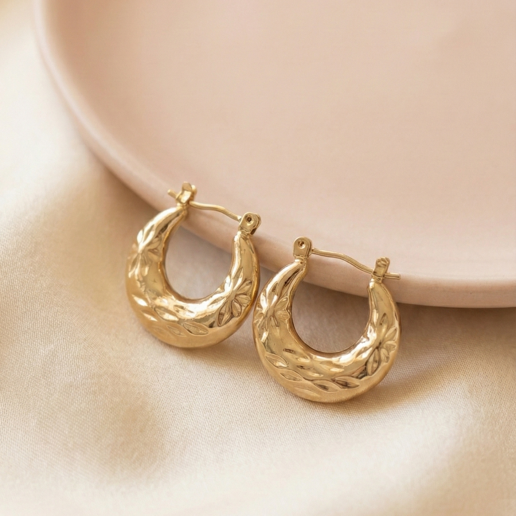 Carved Gold Chunky Hoop Earrings - Textured Huggies - ORYX TREND EaringElevate your earring stack with the ORYX trend Carved Gold Chunky Hoop Earrings. These small, substantial hoops feature a beautiful etched, starburst texture that catches the light and adds a vintage-inspired touch. Designed for comfortable, everyday wear, these huggies are the perfect size for adding a pop of golden glamour. A timeless and versatile addition to your ORYX trend collection of gold jewelry.Default Title#