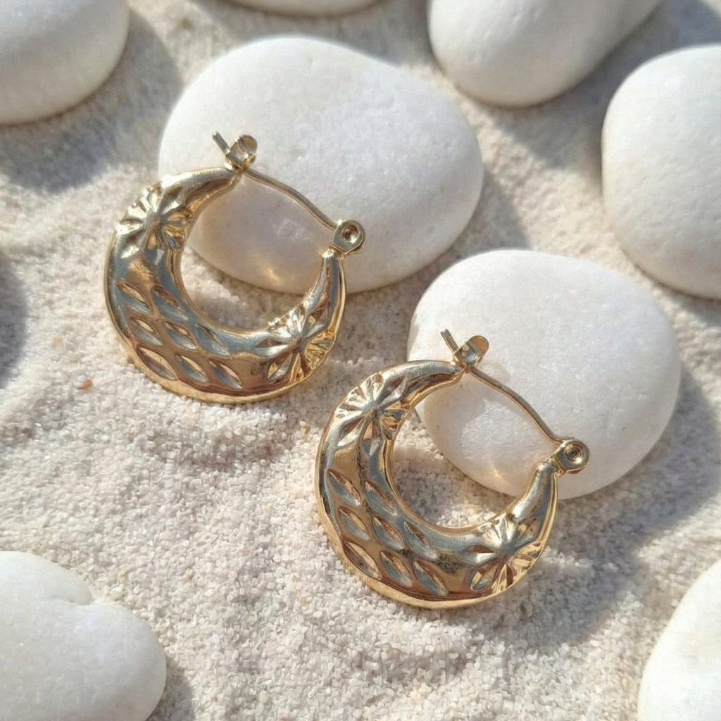Carved Gold Chunky Hoop Earrings - Textured Huggies - ORYX TREND EaringElevate your earring stack with the ORYX trend Carved Gold Chunky Hoop Earrings. These small, substantial hoops feature a beautiful etched, starburst texture that catches the light and adds a vintage-inspired touch. Designed for comfortable, everyday wear, these huggies are the perfect size for adding a pop of golden glamour. A timeless and versatile addition to your ORYX trend collection of gold jewelry.Default Title#