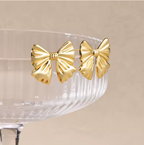 Chic Gold Bow Stud Earrings - ORYX TREND EaringThese charming gold bow stud earrings are a sweet and stylish accessory. Featuring a classic and elegant bow shape, they have a subtle, folded texture that adds a touch of dimension. Crafted from durable stainless steel, these earrings are perfect for everyday wear and sensitive ears. Their petite size and timeless design make them a delightful addition to any jewelry collection.Default Title#