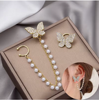 Crystal Butterfly and Pearl Chain Ear Cuff Set - ORYX TREND EaringDesign: Asymmetrical set featuring a pave crystal butterfly stud connected by a double chain of delicate faux pearls to a simple ear cuff.Default Title#