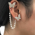 Crystal Butterfly and Pearl Chain Ear Cuff Set - ORYX TREND EaringDesign: Asymmetrical set featuring a pave crystal butterfly stud connected by a double chain of delicate faux pearls to a simple ear cuff.Default Title#