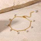 Dainty Pearl and Gold Anklet - ORYX TREND AnkletThis charming gold chain anklet is adorned with delicate, evenly spaced pearl beads, creating a classic and elegant look. The dainty design is perfect for adding a touch of sophistication to your summer style. With its adjustable chain, this pearl anklet offers a comfortable fit for any ankle, making it an ideal accessory for both casual and dressy occasions.Default Title#