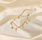 Dainty Pearl and Gold Anklet - ORYX TREND AnkletThis charming gold chain anklet is adorned with delicate, evenly spaced pearl beads, creating a classic and elegant look. The dainty design is perfect for adding a touch of sophistication to your summer style. With its adjustable chain, this pearl anklet offers a comfortable fit for any ankle, making it an ideal accessory for both casual and dressy occasions.Default Title#