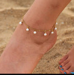 Dainty Pearl and Gold Anklet - ORYX TREND AnkletThis charming gold chain anklet is adorned with delicate, evenly spaced pearl beads, creating a classic and elegant look. The dainty design is perfect for adding a touch of sophistication to your summer style. With its adjustable chain, this pearl anklet offers a comfortable fit for any ankle, making it an ideal accessory for both casual and dressy occasions.Default Title#