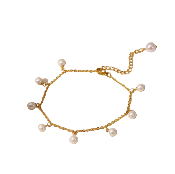 Dainty Pearl and Gold Anklet - ORYX TREND AnkletThis charming gold chain anklet is adorned with delicate, evenly spaced pearl beads, creating a classic and elegant look. The dainty design is perfect for adding a touch of sophistication to your summer style. With its adjustable chain, this pearl anklet offers a comfortable fit for any ankle, making it an ideal accessory for both casual and dressy occasions.Default Title#