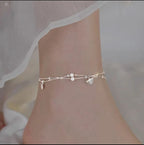 Dainty Silver Beaded Anklet with Ginkgo Charms - ORYX TREND AnkletAdorn your ankle with our minimalist ginkgo leaf charm anklet. The two-layered design includes a sleek chain and a beaded chain, each with tiny, intricate ginkgo leaves. This dainty and elegant piece is a stylish addition to your warm-weather jewelry collection.Default Title#