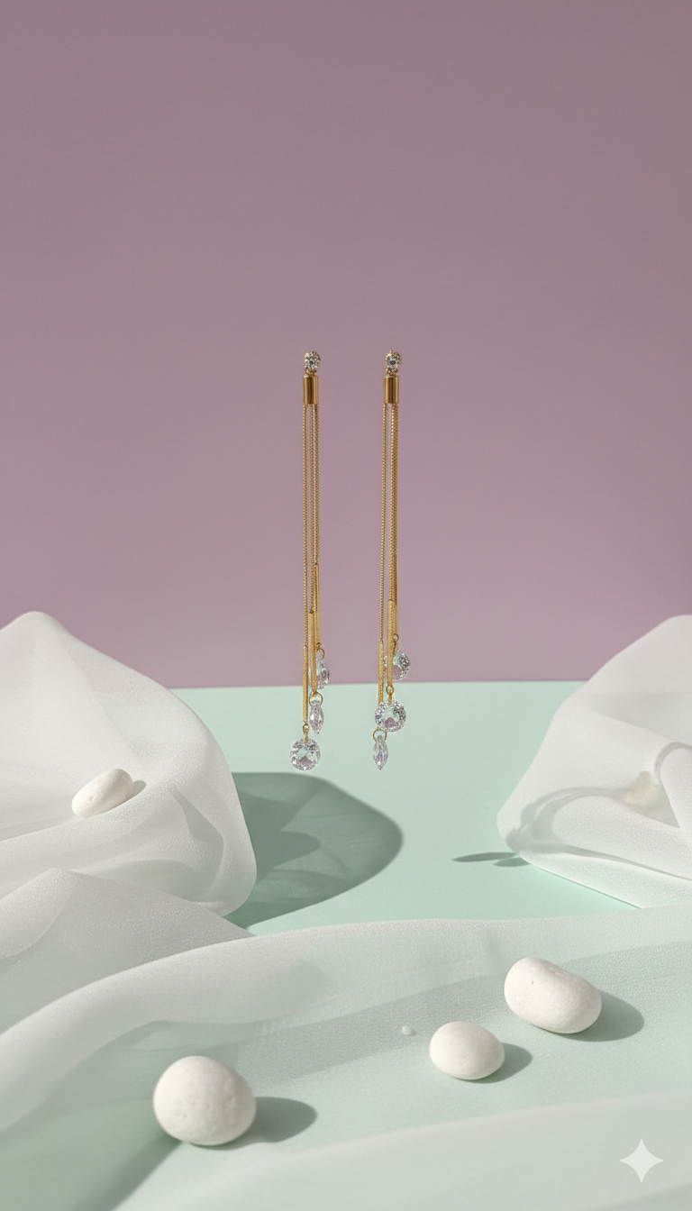 Dazzling CZ Dangle Chain Earrings - ORYX TREND EaringStep into the spotlight with these exquisite Dazzling CZ Dangle Chain Earrings. Featuring three cascading gold chains that end with brilliant, faceted Cubic Zirconia (CZ) stones, these long drop earrings add movement and sparkle to any look. The tassel design is lightweight and glamorous, perfect for weddings, parties, or special evenings. Style: Drop, Dangle, Tassel, Elegant, GlamourDefault Title#