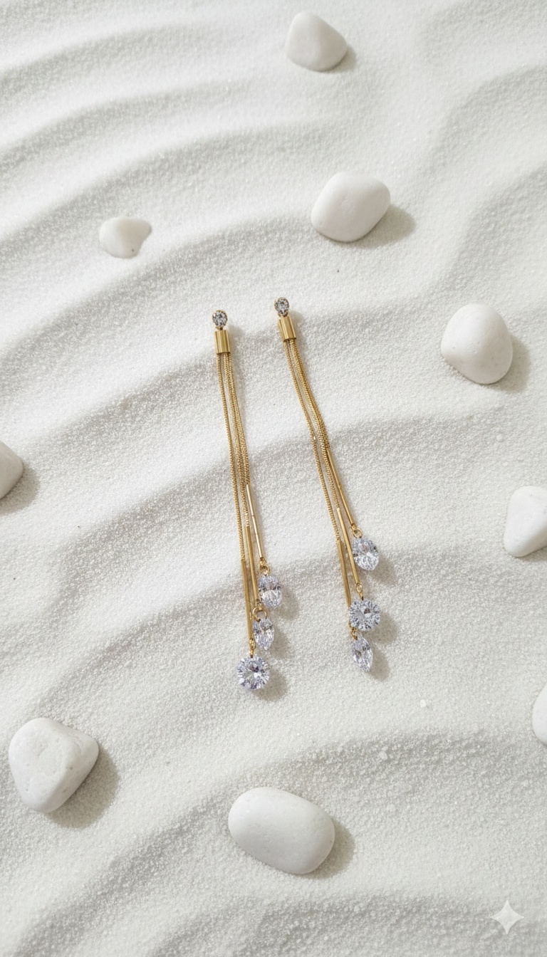 Dazzling CZ Dangle Chain Earrings - ORYX TREND EaringStep into the spotlight with these exquisite Dazzling CZ Dangle Chain Earrings. Featuring three cascading gold chains that end with brilliant, faceted Cubic Zirconia (CZ) stones, these long drop earrings add movement and sparkle to any look. The tassel design is lightweight and glamorous, perfect for weddings, parties, or special evenings. Style: Drop, Dangle, Tassel, Elegant, GlamourDefault Title#