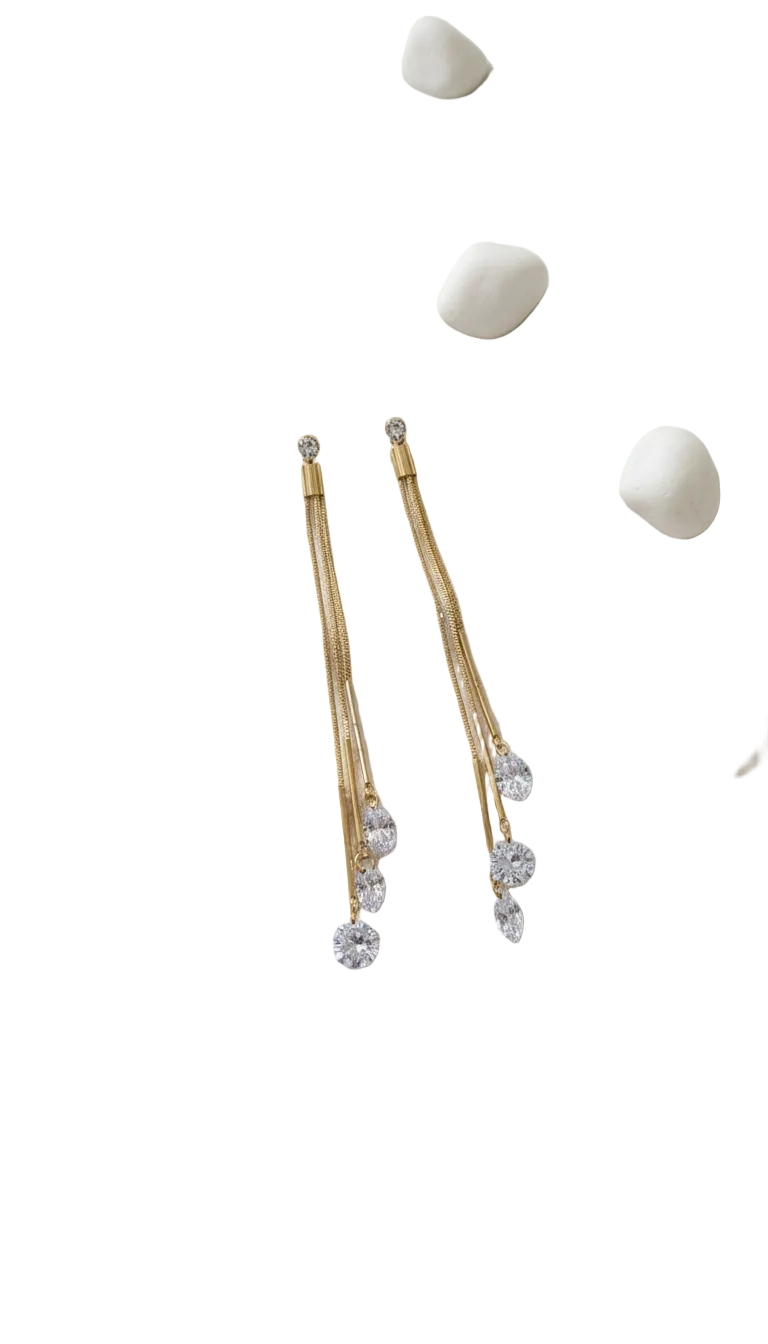 Dazzling CZ Dangle Chain Earrings - ORYX TREND EaringStep into the spotlight with these exquisite Dazzling CZ Dangle Chain Earrings. Featuring three cascading gold chains that end with brilliant, faceted Cubic Zirconia (CZ) stones, these long drop earrings add movement and sparkle to any look. The tassel design is lightweight and glamorous, perfect for weddings, parties, or special evenings. Style: Drop, Dangle, Tassel, Elegant, GlamourDefault Title#