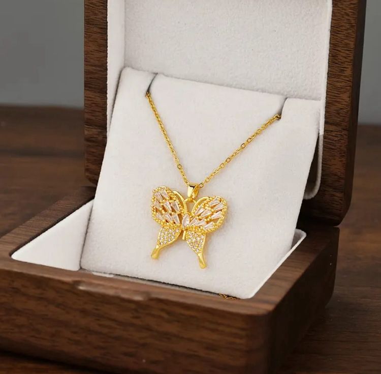 Dazzling Gold Butterfly Necklace - ORYX TREND NecklaceElevate your style with this exquisite gold-plated butterfly necklace. Featuring a beautifully crafted butterfly pendant adorned with sparkling cubic zirconia (CZ) stones, this piece captures the essence of elegance and freedom. The delicate design and brilliant shine make it a perfect accessory for both everyday wear and special occasions.Default Title#
