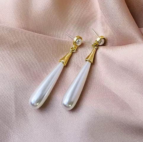 Elegant Tear Drop Pearl Dangle Earrings - ORYX TREND EaringLong, sophisticated drop earrings featuring a single, large, elongated tear drop faux pearl suspended from a small pearl stud.Default Title#