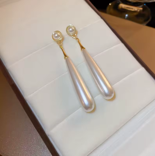 Elegant Tear Drop Pearl Dangle Earrings - ORYX TREND EaringLong, sophisticated drop earrings featuring a single, large, elongated tear drop faux pearl suspended from a small pearl stud.Default Title#