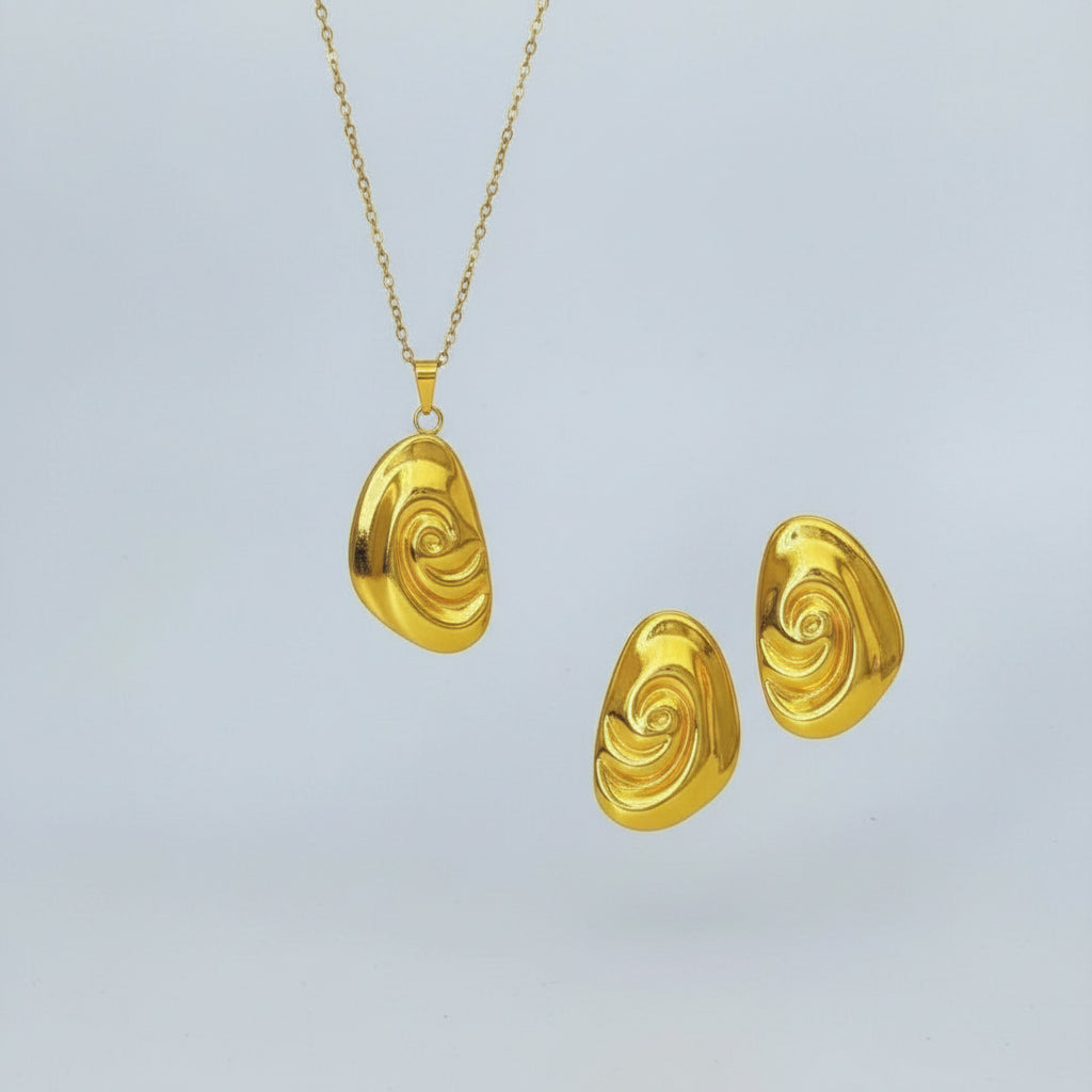 Golden Abstract Swirl Necklace & Earrings Set - Unique Statement Jewelry - ORYX TREND Necklace SetMake a bold statement with this stunning golden jewelry set. The set includes a unique necklace with a fluid, abstract swirl pendant and a pair of matching stud earrings. The polished, high-shine finish gives this contemporary design a luxurious feel. Perfect for adding an artistic touch to your outfit, this set is a must-have for those who love modern and unconventional accessories.Default Title#