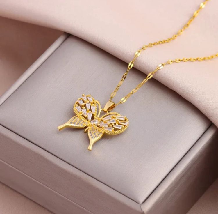 Dazzling Gold Butterfly Necklace - ORYX TREND NecklaceElevate your style with this exquisite gold-plated butterfly necklace. Featuring a beautifully crafted butterfly pendant adorned with sparkling cubic zirconia (CZ) stones, this piece captures the essence of elegance and freedom. The delicate design and brilliant shine make it a perfect accessory for both everyday wear and special occasions.Default Title#