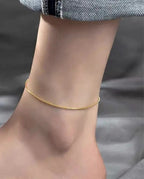 Gold Chain Anklet - ORYX TREND Anklethis delicate and chic gold chain anklet adds a subtle touch of elegance to any look. Its sleek and minimalist design makes it perfect for layering or wearing on its own. Crafted from durable material, this dainty gold anklet is an essential accessory for both casual and dressy occasions, offering a sophisticated shimmer with every step.Default Title#