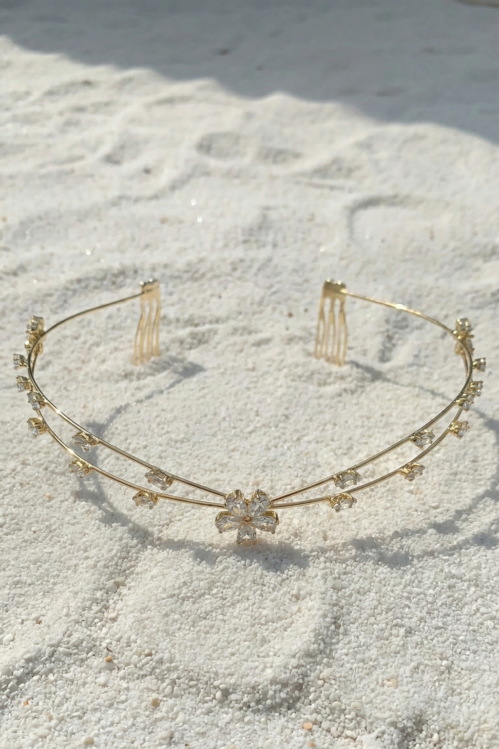 Gold headband with small decorative elements on a textured surface