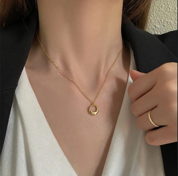 Minimalist Gold Interlocking Circles Necklace - ORYX TREND NecklaceAchieve effortless elegance with this chic, minimalist necklace. Featuring two delicately interlocking circles in a bright gold finish, this piece symbolizes connection and timeless style. The dainty chain makes it perfect for everyday wear or layering with other favorites. A versatile accessory that transitions seamlessly from the office to a night out.Default Title#