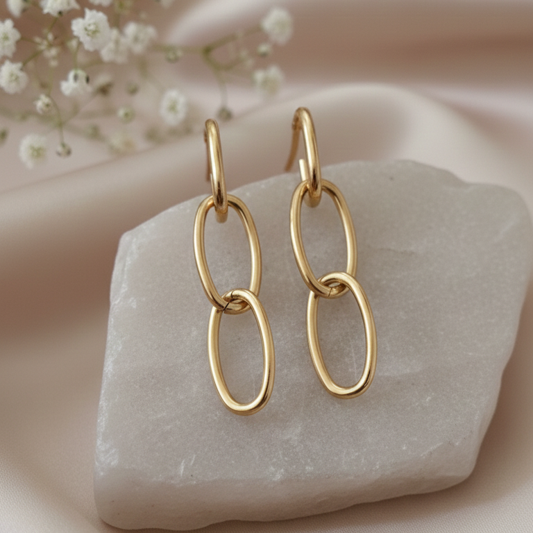 Gold Link Chain Drop Earrings - ORYX TREND EaringMake a subtle yet stylish impact with these Gold Link Chain Drop Earrings. Featuring three interlocking oval loops, this design offers a modern, minimalist take on classic chain-link jewelry. Lightweight and polished, they are the perfect versatile statement piece for daily wear or an evening out. A must-have for lovers of contemporary gold accessories. Style: Drop, Chain Link, Minimalist, ContemporaryDefault Title#