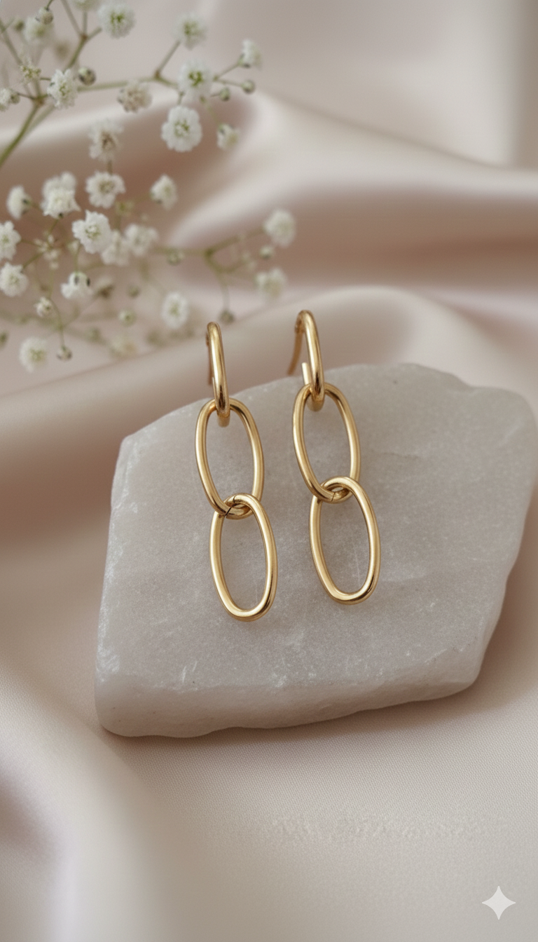 Gold Link Chain Drop Earrings - ORYX TREND EaringMake a subtle yet stylish impact with these Gold Link Chain Drop Earrings. Featuring three interlocking oval loops, this design offers a modern, minimalist take on classic chain-link jewelry. Lightweight and polished, they are the perfect versatile statement piece for daily wear or an evening out. A must-have for lovers of contemporary gold accessories. Style: Drop, Chain Link, Minimalist, ContemporaryDefault Title#