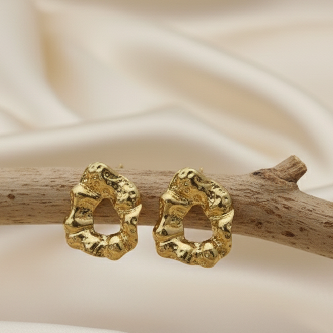 Statement Gold-Tone Molten Nugget Stainless Steel Earrings - ORYX TREND EaringA pair of bold and contemporary earrings featuring a distinctive, organic, "molten" texture. The abstract, irregular shape and hammered-look finish give them a high-fashion, artisanal appeal. Crafted from durable stainless steel and finished in a bright gold tone, these earrings are designed to be long-lasting and make a powerful statement. Perfect for adding a modern, sculptural touch to any outfit.Default Title#