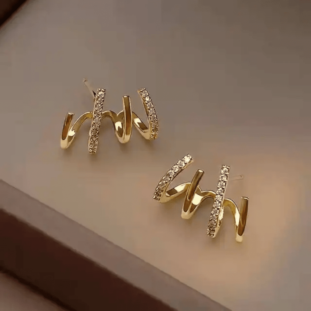 Prong Stud Earrings - ORYX TREND EaringUnique stud earrings featuring four curved, overlapping prongs or lines in a stylized claw shape.Default Title#