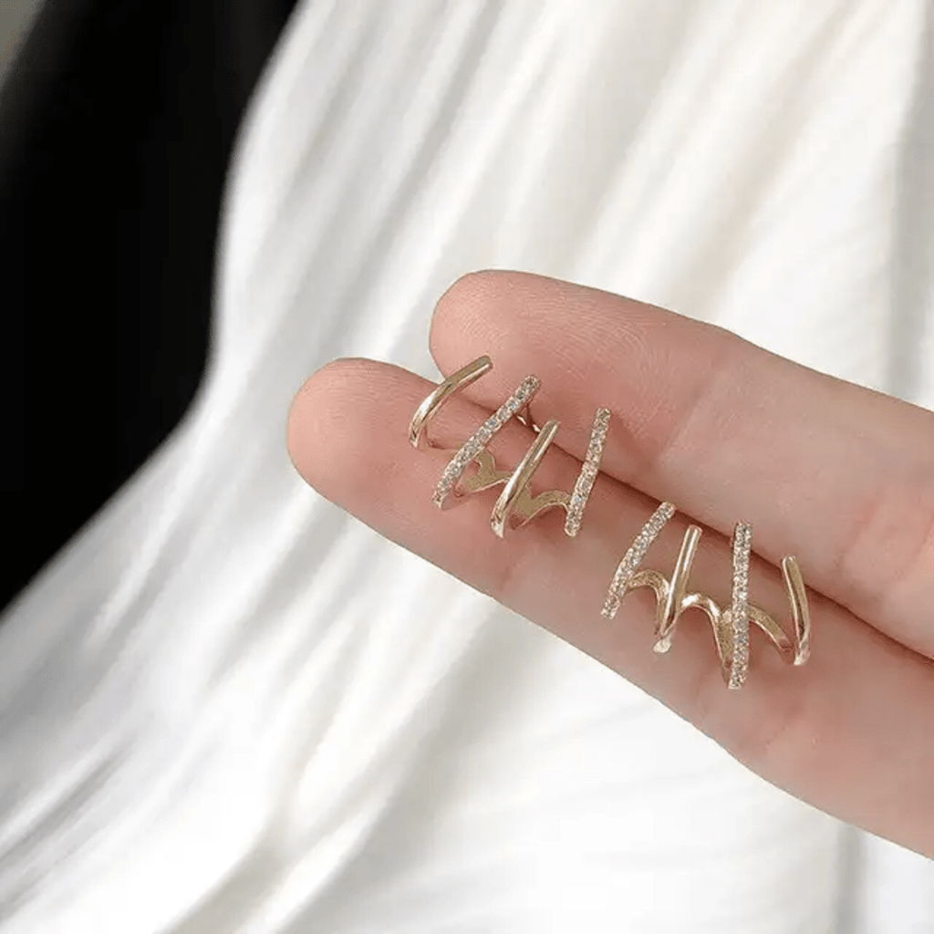 Prong Stud Earrings - ORYX TREND EaringUnique stud earrings featuring four curved, overlapping prongs or lines in a stylized claw shape.Default Title#