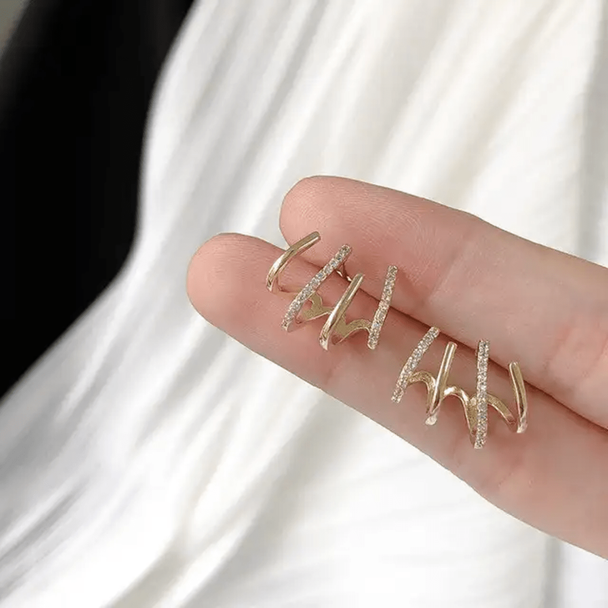 Prong Stud Earrings - ORYX TREND EaringUnique stud earrings featuring four curved, overlapping prongs or lines in a stylized claw shape.Default Title#