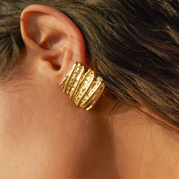 Gold Sculptural Statement Earrings - ORYX TREND EaringThese bold, gold statement earrings feature a unique, sculptural design with a striking, textured surface. Their rectangular shape and uneven, layered finish create a modern, abstract look that catches the light beautifully. Perfect for adding a touch of artistic flair to any outfit, these chunky gold earrings are a versatile accessory for both everyday wear and special occasions.Default Title#