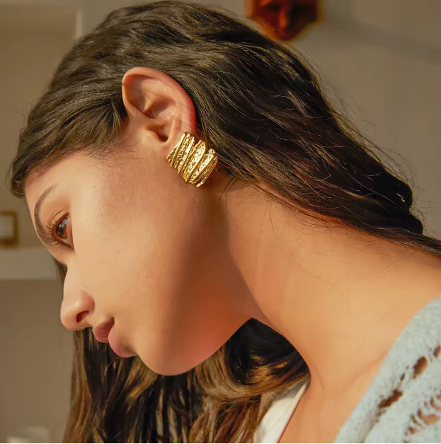 Gold Sculptural Statement Earrings - ORYX TREND EaringThese bold, gold statement earrings feature a unique, sculptural design with a striking, textured surface. Their rectangular shape and uneven, layered finish create a modern, abstract look that catches the light beautifully. Perfect for adding a touch of artistic flair to any outfit, these chunky gold earrings are a versatile accessory for both everyday wear and special occasions.Default Title#
