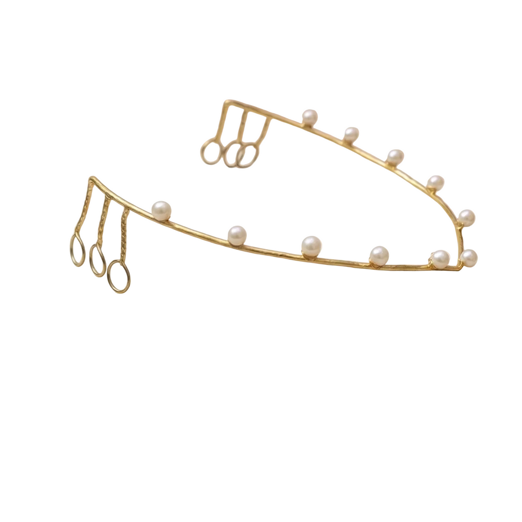 Gold headband with pearls on a white background