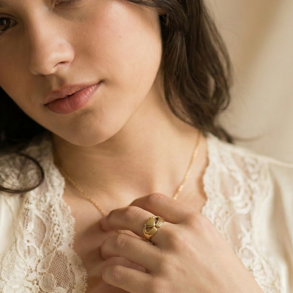 Woman wearing a white lace top against a beige background