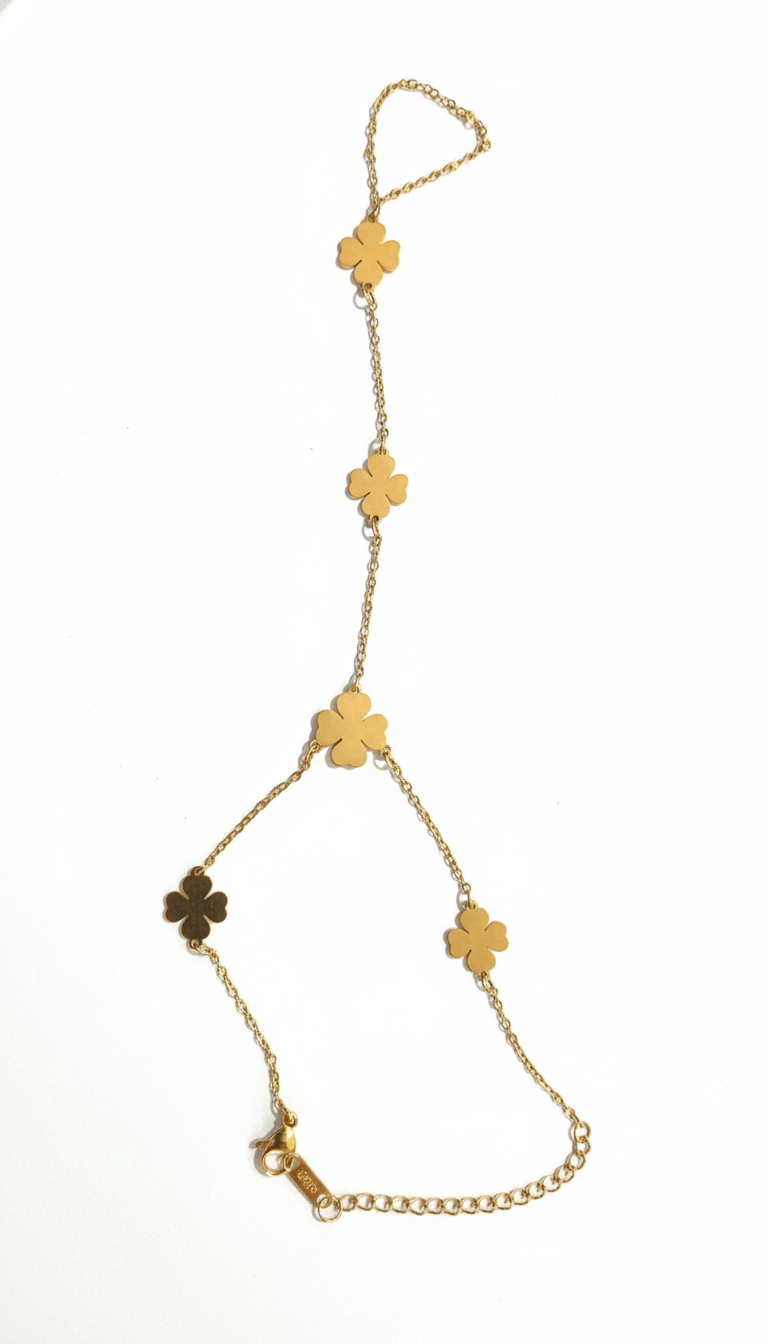 Gold chain necklace with clover-shaped pendants on a white background