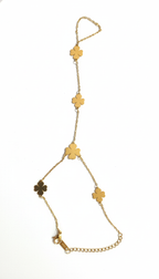 Gold chain necklace with clover-shaped pendants on a white background