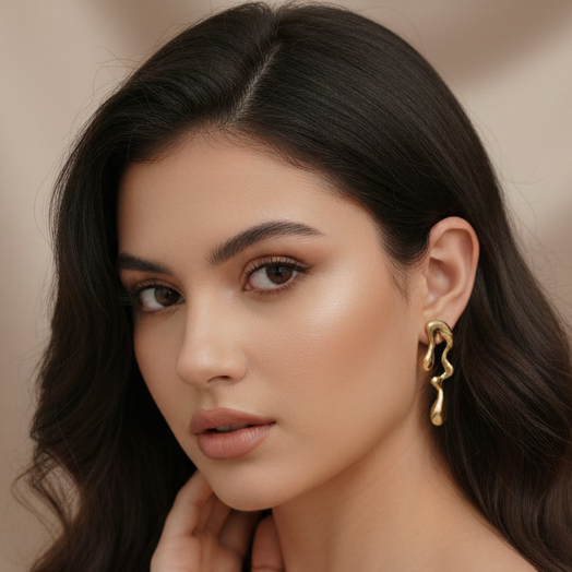 Melted Gold Drip Stud Earrings - ORYX TREND EaringMake a modern statement with these captivating Melted Gold Drip Stud Earrings. Featuring a popular liquid metal or abstract design, these studs mimic the look of dripping gold, offering a unique, sculptural touch to any ensemble. Perfect for the fashion-forward individual seeking edgy, contemporary jewelry. Lightweight and polished for high shine. Style: Abstract, Liquid Metal, Drip, ModernDefault Title#