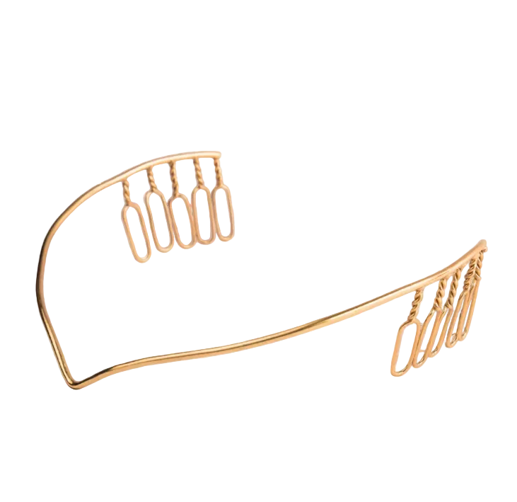 Gold-colored hair clip on a white background