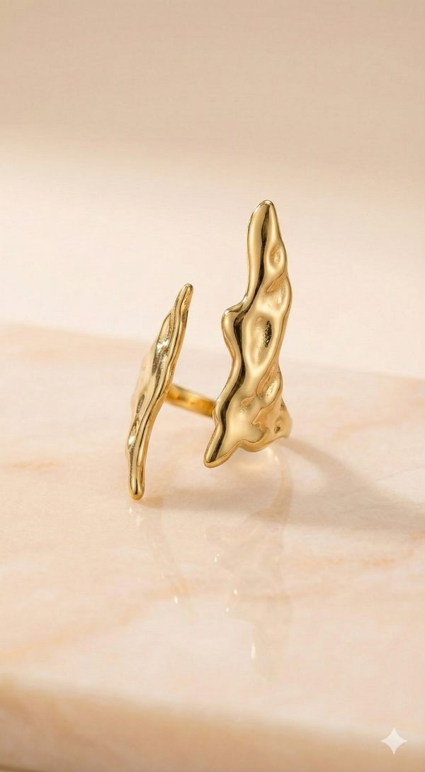 Molten Gold Open Cuff Ring - Organic Statement Jewelry - ORYX TREND RingEmbrace the beauty of imperfection with the ORYX trend Molten Gold Open Cuff Ring. This captivating piece features a unique, fluid, organic texture that mimics the look of cooled liquid gold. The adjustable open cuff design ensures a perfect fit, making it a comfortable and bold statement piece. Perfect for those who love nature-inspired yet contemporary gold jewelry. Discover your new favorite accessory from ORYX trend.Default Title#