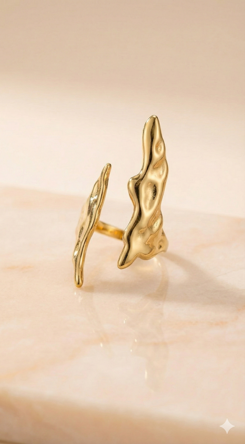 Molten Gold Open Cuff Ring - Organic Statement Jewelry - ORYX TREND RingEmbrace the beauty of imperfection with the ORYX trend Molten Gold Open Cuff Ring. This captivating piece features a unique, fluid, organic texture that mimics the look of cooled liquid gold. The adjustable open cuff design ensures a perfect fit, making it a comfortable and bold statement piece. Perfect for those who love nature-inspired yet contemporary gold jewelry. Discover your new favorite accessory from ORYX trend.Default Title#