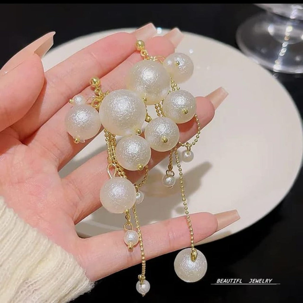 Pearl Cluster Dangle Earrings - ORYX TREND EaringDesign: Dramatic drop earrings featuring a dense cluster of various-sized faux pearls at the top, followed by longer, dangling pearl-tipped chains.Default Title#