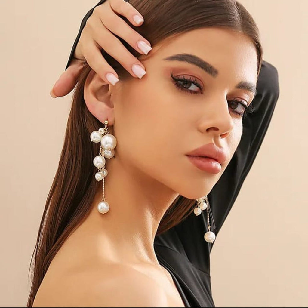 Pearl Cluster Dangle Earrings - ORYX TREND EaringDesign: Dramatic drop earrings featuring a dense cluster of various-sized faux pearls at the top, followed by longer, dangling pearl-tipped chains.Default Title#