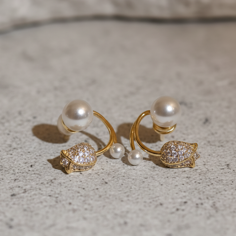 Tulip and Pearl Ear Jacket Studs - ORYX TREND EaringUnique ear jackets featuring a pave crystal tulip/flower stud with a curved gold bar that sits behind the lobe, tipped with graduated faux pearls.Default Title#