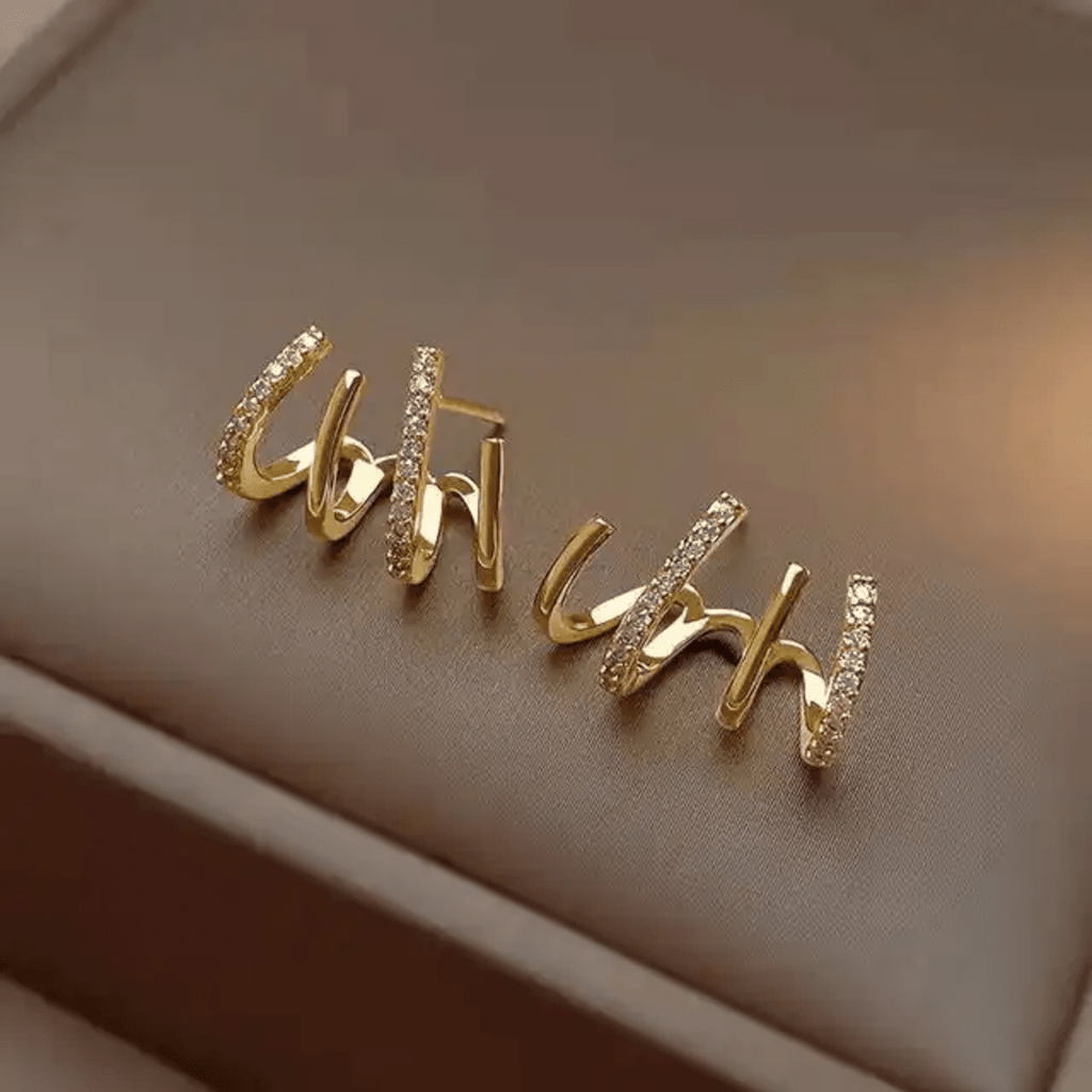 Prong Stud Earrings - ORYX TREND EaringUnique stud earrings featuring four curved, overlapping prongs or lines in a stylized claw shape.Default Title#