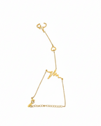 Gold bracelet with star design on a white background