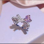 Silver-Plated Cubic Zirconia Bow and Heart Necklace and Earring Set - ORYX TREND NecklaceElevate your style with our charming pink heart and bow jewelry set. This beautiful necklace and earring set is adorned with sparkling rhinestones and a cubic zirconia heart, making it an ideal accessory for any outfit. It's a perfect gift for someone special.Default Title#