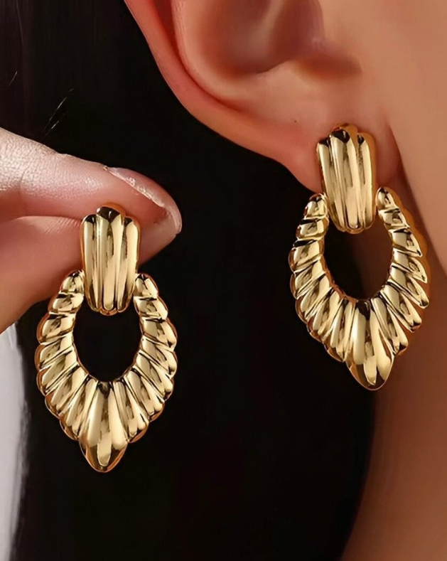 Statement Gold-Tone Croissant Textured Drop Earrings - ORYX TREND EaringMake a bold impact with these unique drop earrings. They feature a chunky, highly textural design, often referred to as a "croissant" or ribbed texture, in a rich gold tone. The earrings are secured with a simple, polished stud or post back. Made from durable stainless steel, these fashionable pieces are resistant to tarnishing, offering a high-end look with long-lasting quality. Perfect for elevating any outfit.Default Title#