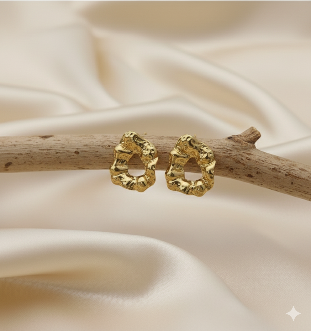 Statement Gold-Tone Molten Nugget Stainless Steel Earrings - ORYX TREND EaringA pair of bold and contemporary earrings featuring a distinctive, organic, "molten" texture. The abstract, irregular shape and hammered-look finish give them a high-fashion, artisanal appeal. Crafted from durable stainless steel and finished in a bright gold tone, these earrings are designed to be long-lasting and make a powerful statement. Perfect for adding a modern, sculptural touch to any outfit.Default Title#