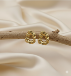 Statement Gold-Tone Molten Nugget Stainless Steel Earrings - ORYX TREND EaringA pair of bold and contemporary earrings featuring a distinctive, organic, "molten" texture. The abstract, irregular shape and hammered-look finish give them a high-fashion, artisanal appeal. Crafted from durable stainless steel and finished in a bright gold tone, these earrings are designed to be long-lasting and make a powerful statement. Perfect for adding a modern, sculptural touch to any outfit.Default Title#