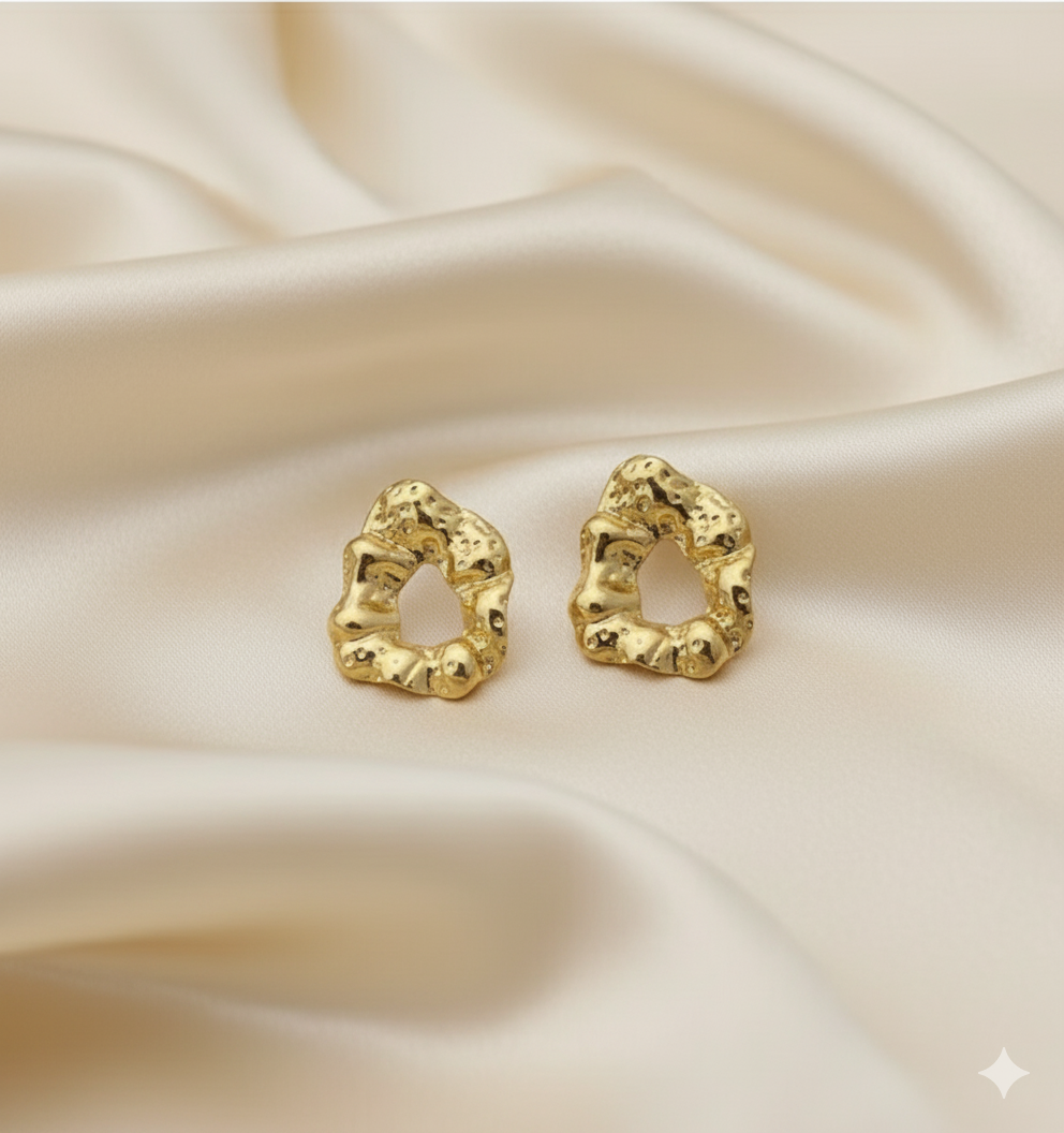 Statement Gold-Tone Molten Nugget Stainless Steel Earrings - ORYX TREND EaringA pair of bold and contemporary earrings featuring a distinctive, organic, "molten" texture. The abstract, irregular shape and hammered-look finish give them a high-fashion, artisanal appeal. Crafted from durable stainless steel and finished in a bright gold tone, these earrings are designed to be long-lasting and make a powerful statement. Perfect for adding a modern, sculptural touch to any outfit.Default Title#